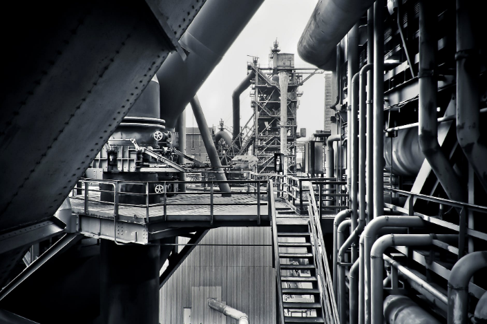 a black and white shot of a factory